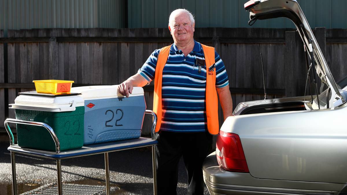 MEALS: Russell Leviston unpacks after a morning round delivering meals for Meals On Wheels in 2019. The service is continuing during the coronavirus outbreak Picture: Adam Trafford.