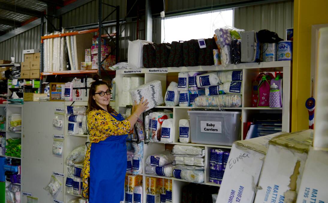 AT WORK: Eureka Mums staff are continuing to fulfil orders for families in need, while the warehouse is now closed to volunteers and community donations. Picture: Neil Para 