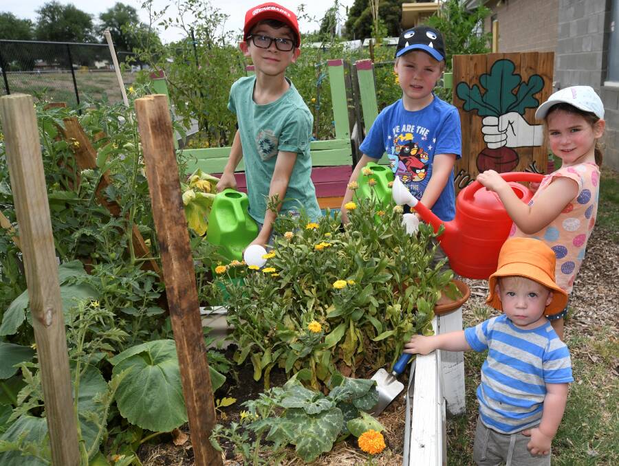 EDUCATE: 8-year-old Lucas, 6-year-old Luka, 4-year-old Ella and 2-year-old Conor at the Food is Free Green Space. Picture: Lachlan Bence 