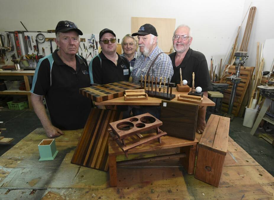 RECYCLE: Ballarat Community Men's Shed members Terry Williams, James Tournier, Bernie Crisp, Lance Jewell, Ken Young have been making items for their family members from recycled wood. Picture: Lachlan Bence 
.