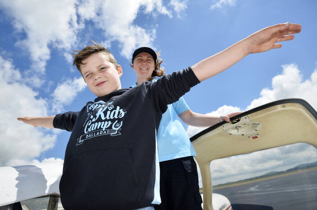 Eight-year-old Ned Sinclaire and Senior Constable Kirsty Robinson at the Cops N Kids camp in 2016. Picture: Dylan Burns