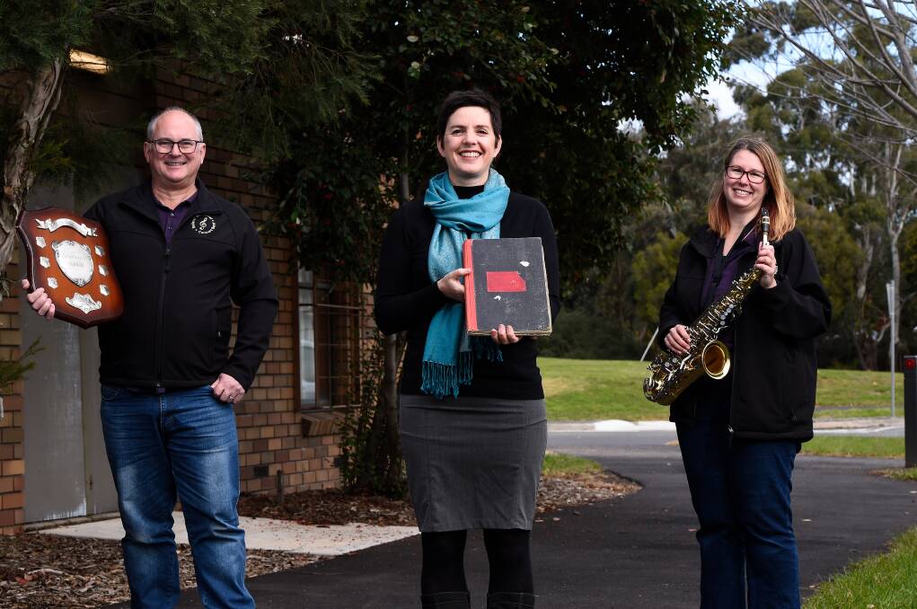 MILESTONE: Ballarat Memorial Concert Band president Tony Rowlands, history book author George Williams and former president Bec Paton are celebrating 100 years of the band. Pictures: Adam Trafford 