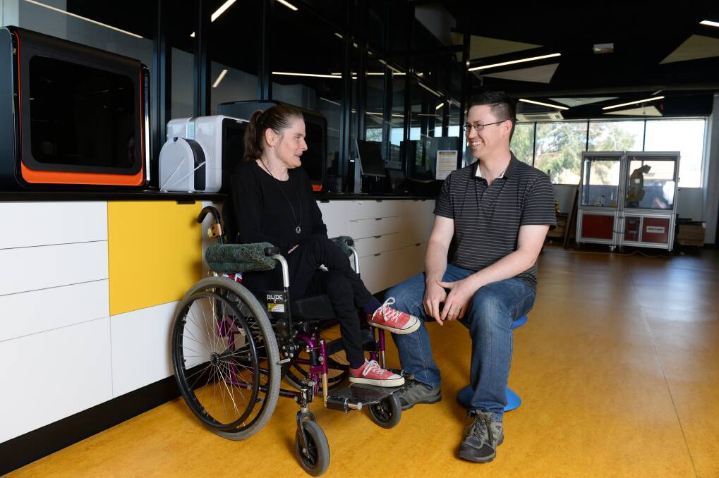CREATE: Jo Smith and Rob Layton will work together during the TOM Makeathon weekend in Ballarat to create a device that can help put on and tie her shoes. Picture: Kate Healy 