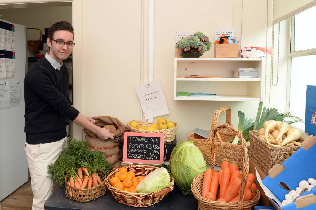 FRESH: Ballarat Wholefoods Collective member Jy Drowley volunteered for his first shift at the store on Thursday. 