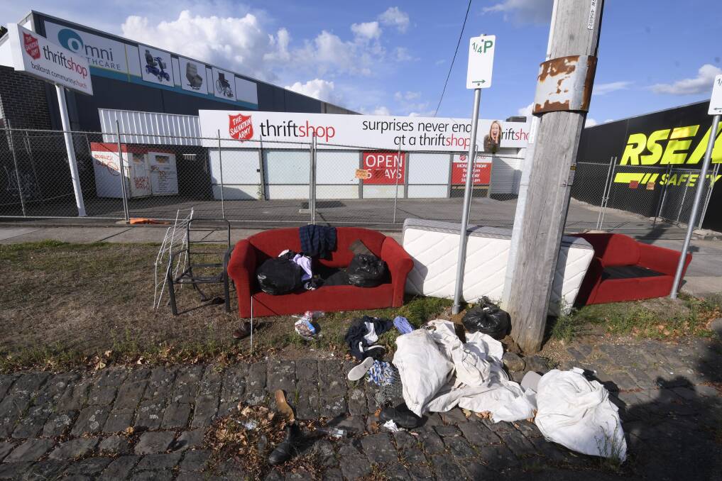 DUMPED: Unwanted items have been left outside Salvation Army thrift shops, despite notices saying they are closed and items will go to waste. Picture: Lachlan Bence 