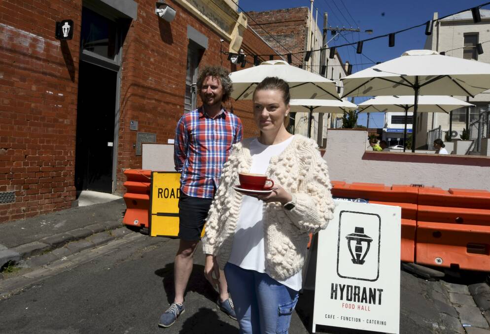 NEW SPACES: Hydrant Food Hall owners Sam Rowe and Elise Rowe use an outdoor dining area in the laneway Picture: Lachlan Bence 