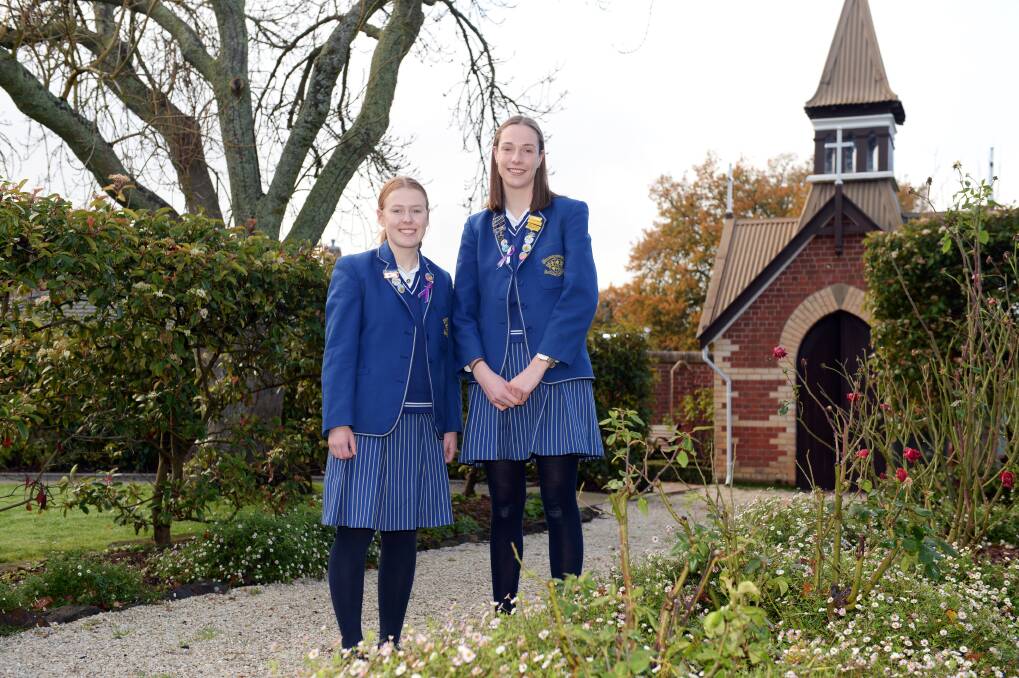 RECOGNISE: Year 12 Loreto College students Eliza McCrum and Chloe Stevens are collating stories of young people's acts of kindness in an e-book. Picture: Kate Healy 
