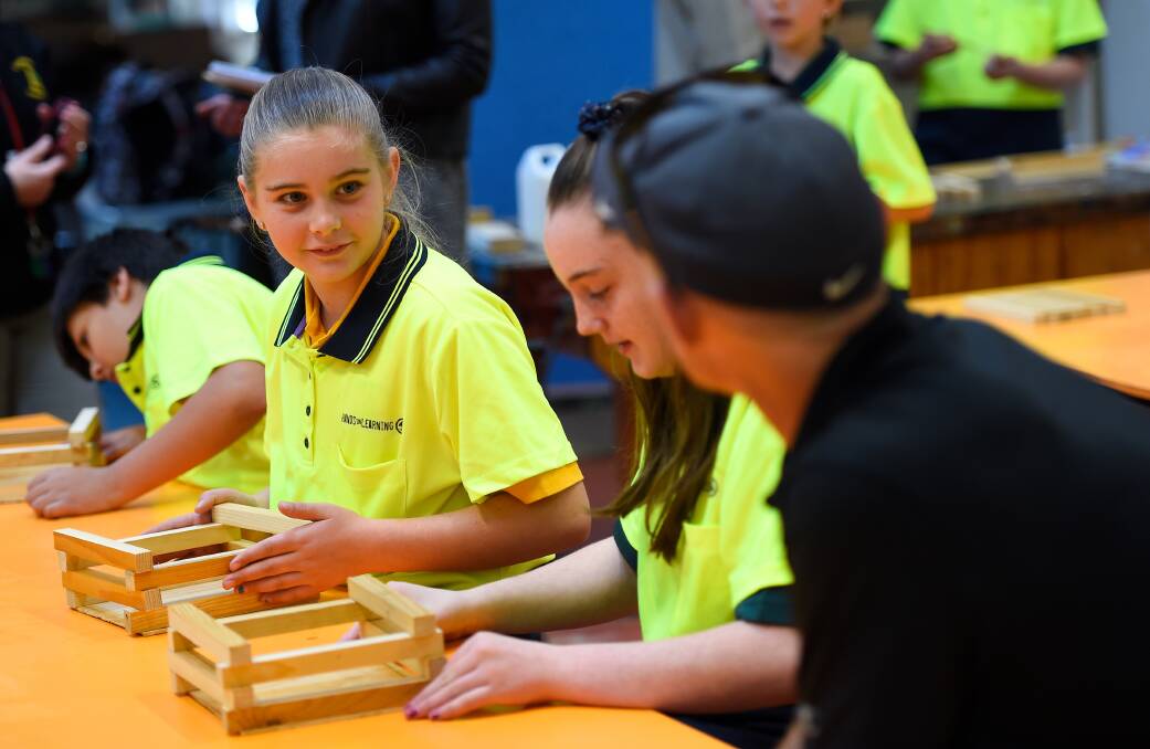 ENGAGED: Creswick Primary School pupil Caitly builds a planter box while forming relationships with her schoolmates during the Hands on Learning program. Picture: Adam Trafford 