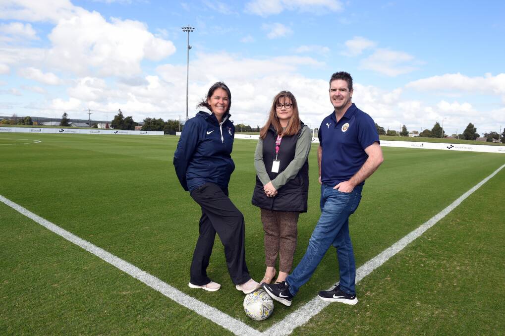 SUICIDE PREVENTION: Ballarat City director of football Laura Brady and club chairperson David Sproules with Lifeline Ballarat program manager Jodie van Schie. Picture: Kate Healy 