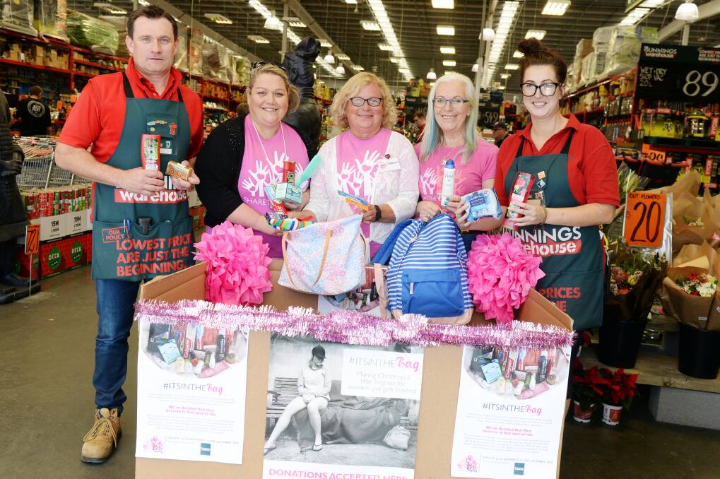DONATE: Bunnings manager Justin Catley, Share the Dignity volunteers Nicole Quinlan-Roberts, Barbara Merrifield and Andrea Whimpenny and Bunnings activited coordinator Maddy Bertram show off the collection box. Picture: Kate Healy 
