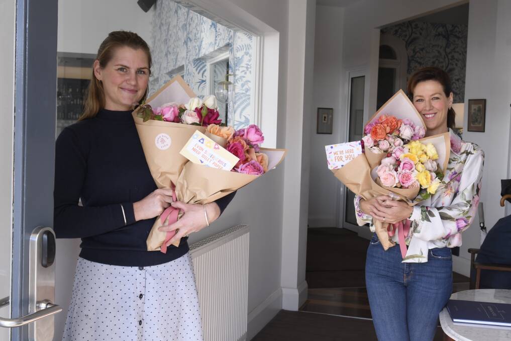 GIVING: Soho Rose Farm owner Kristy Tippett and Provincial Hotel owner Gorgi Coghlan have worked together to offer free bouquets of roses as gifts to vulnerable people and health care workers in Ballarat. Picture: Lachlan Bence