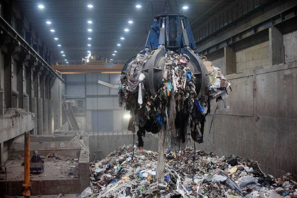 Trash piled nine yards high awaits incineration inside the waste to energy agency plant in Oslo, Norway. Roughly half the city and most of its schools are heated by burning garbage. Picture: Brian Cliff Olguin
