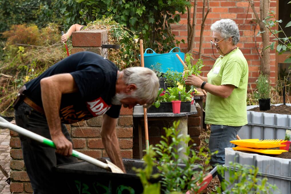VOLUNTEER: Robert and Althea Oliver work during a permablitz in Ballarat in April. Picture: Adam Trafford 