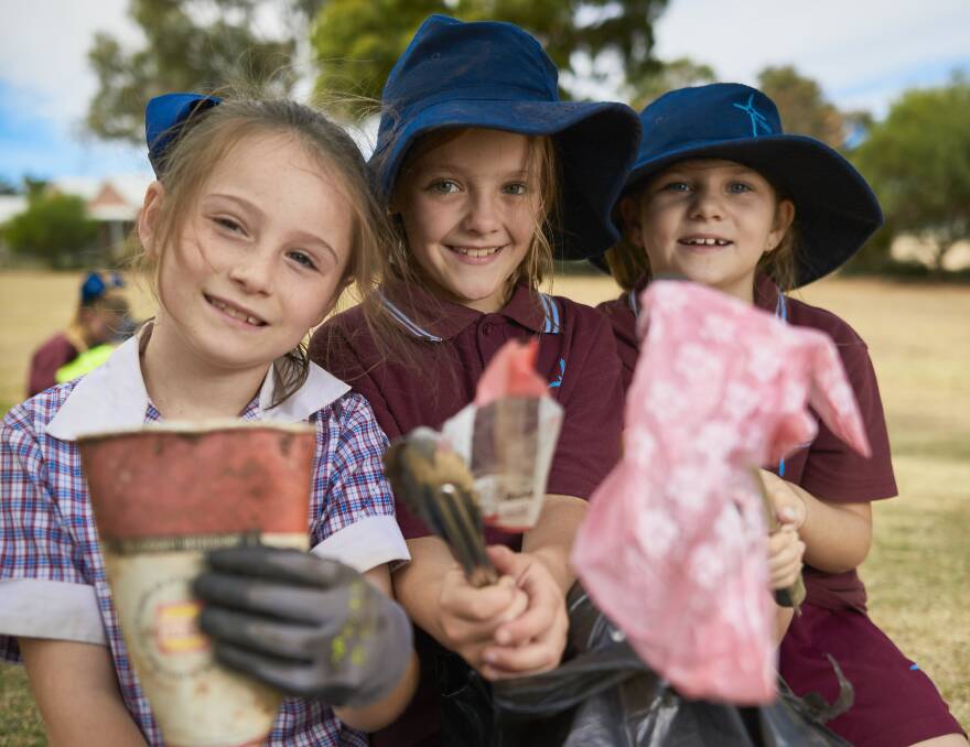 PICK IT UP: World Environment Day sends a message to people of all ages that small actions can make big change. St Alipius grade three pupils Sophie, Bridi and Bianca picked up rubbish on Clean Up Australia Day. Picture: Luka Kauzlaric 