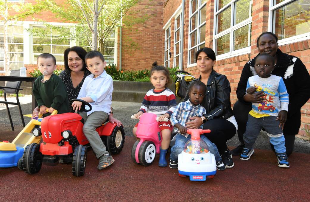 Charlie, 2, Deb Lauton, Josh, 5, Susan Dahal, Goy, 2, Mary Sasa and Jang, 18 months, play together during the Ballarat Regional Multicultrual Council child-minding service. 