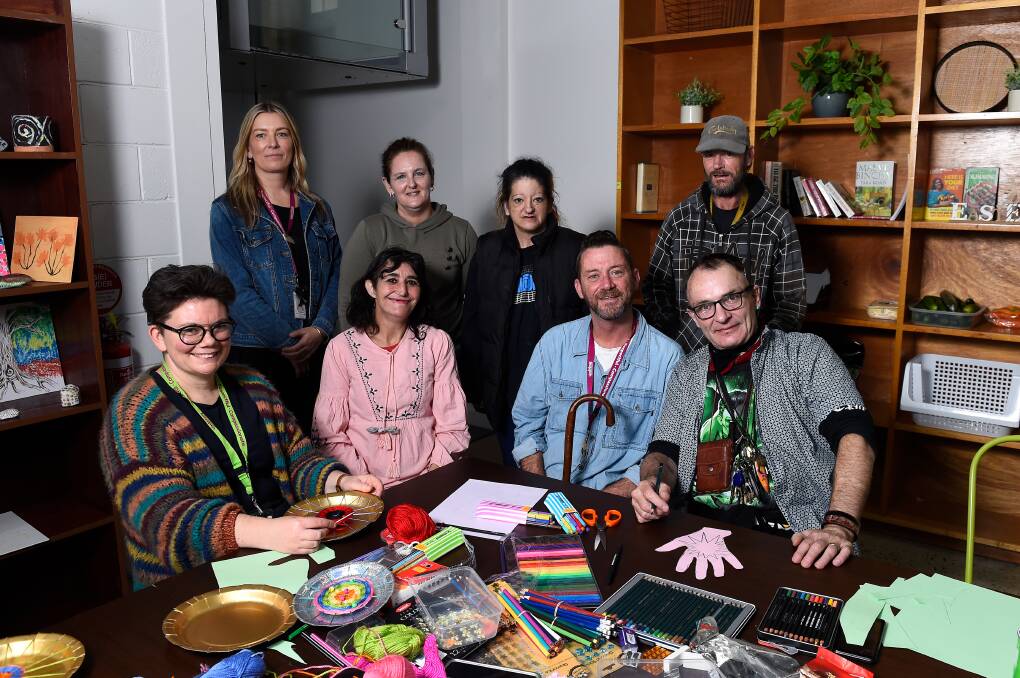 Jeremey Gunning with participants of the art class he runs each week in his role as a homelessness peer support worker at Uniting Ballarat. 