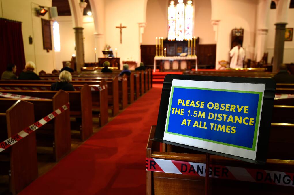 Emotional return to Sunday church service under eased restrictions