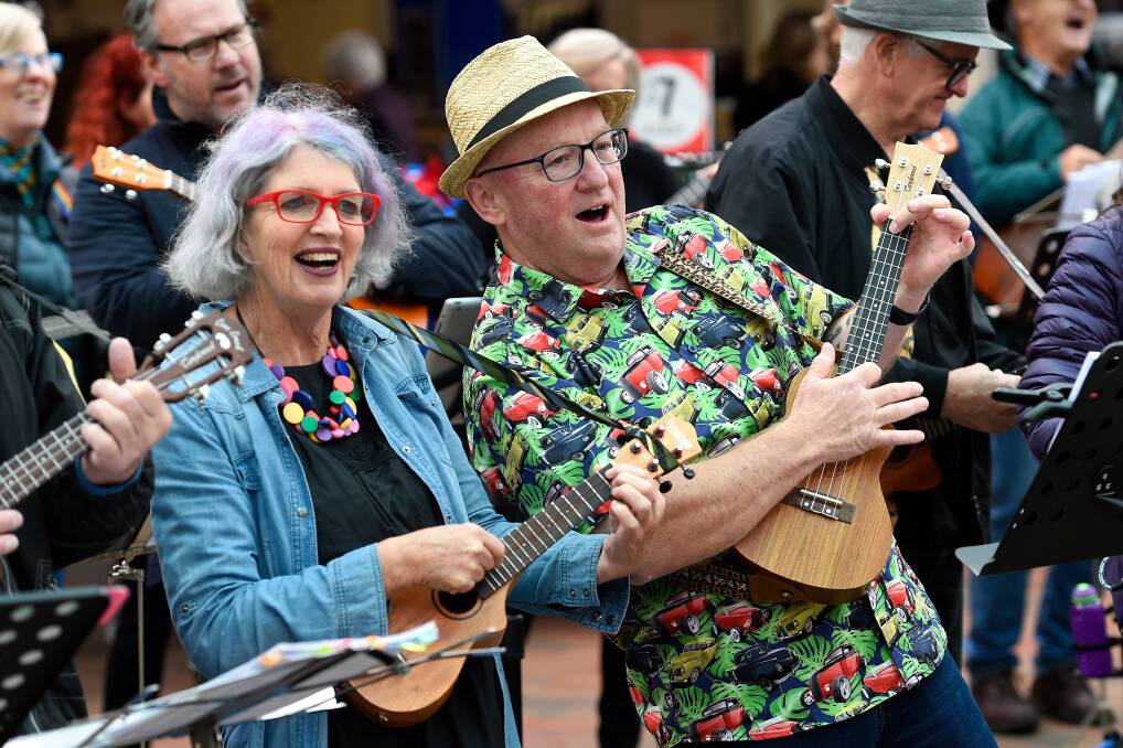 FUN: Christine Hickson and Rob McDougall perform as part of the Ballarat Ukulele Group at the Bridge Mall Farmers' Market. Pictures: Adam Trafford 