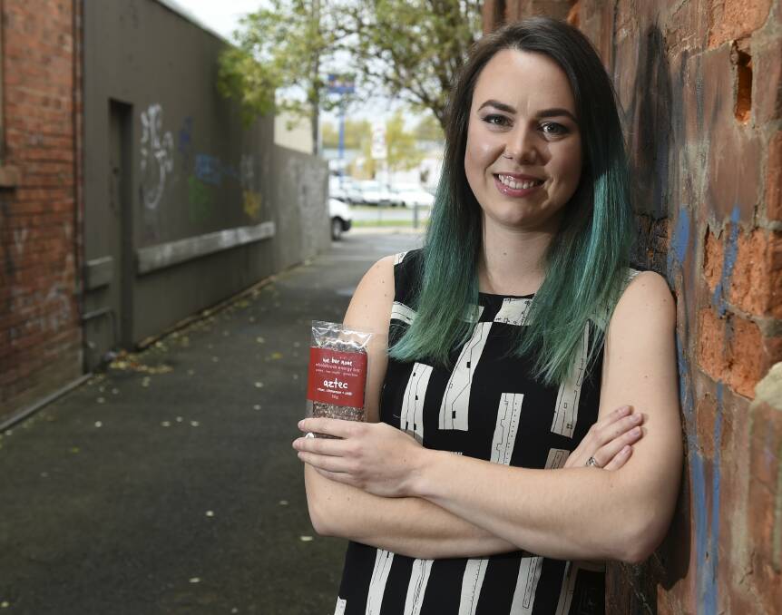 NATURAL BREAKDOWN: Ballarat small business owner Ellen Burns is changing the packaging on her health food bars from recyclable to home compostable in a bid to reduce waste. The wrappers break down naturally in compost. Picture: Lachlan Bence 