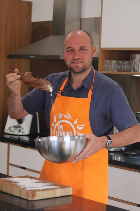APRONS ON: Jeremy Caunt does not have much baking experience, but is happy to give it a go to raise awareness for a good cause. Picture: Rochelle Kirkham 