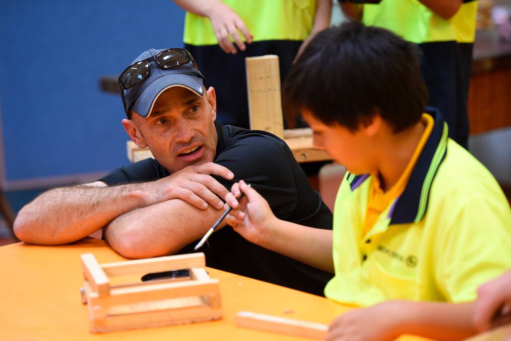 RELATIONSHIPS: Hands on Learning regional Victoria School Support Manager Steve Schneider chats to Creswick Primary School grade five pupil Brandon during a Hands on Learning program day. Picture: Adam Trafford 