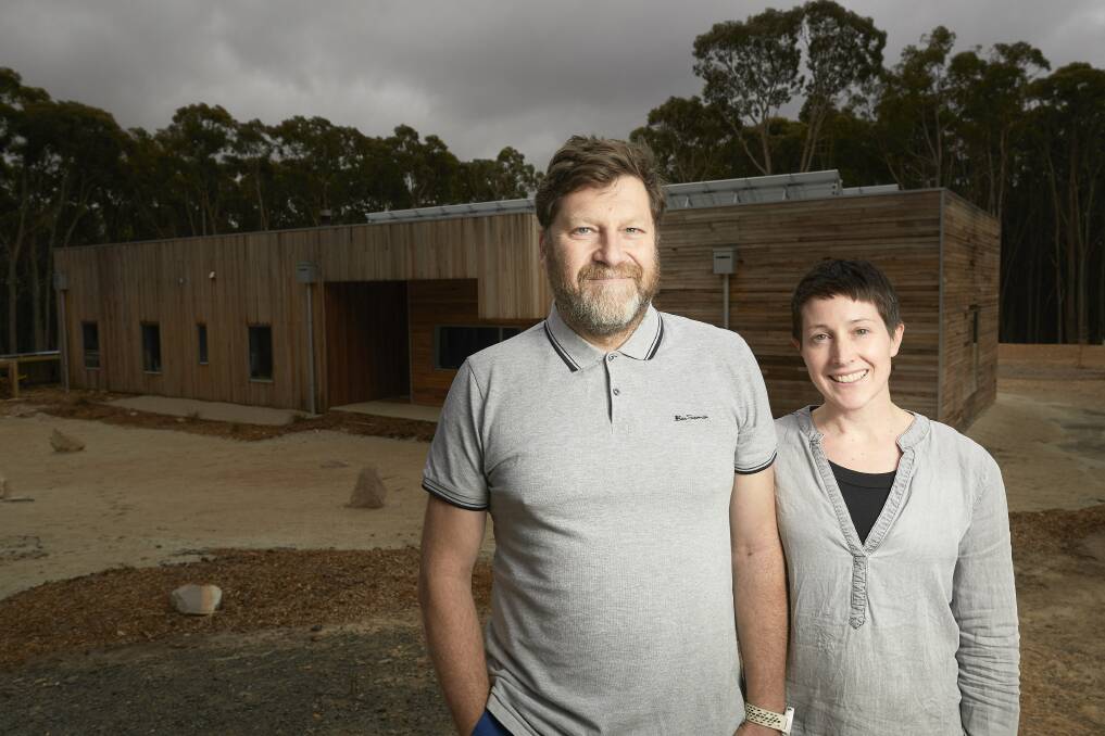 HAVEN: Michael Robinson and Jo Taylor have created their dream home in Mollongghip that is off-grid and helps restore the surrounding forest. Picture: Luka Kauzlaric