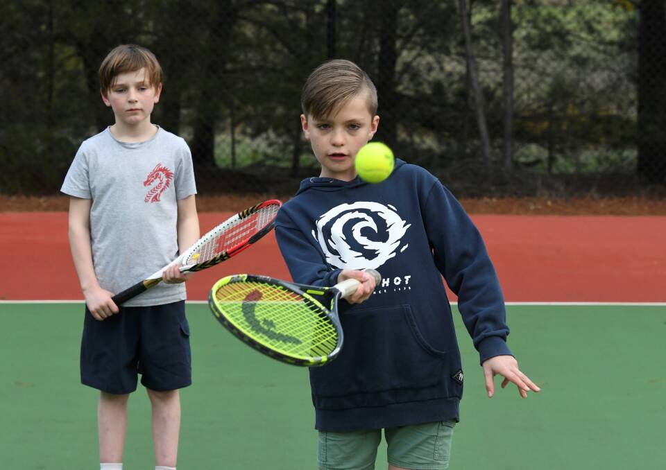 ON COURT: 10-year-old Hamish Micnoten and 11-year-old Matthew Powell play together at the Grenville Tennis Club. Pictures: Lachlan Bence 