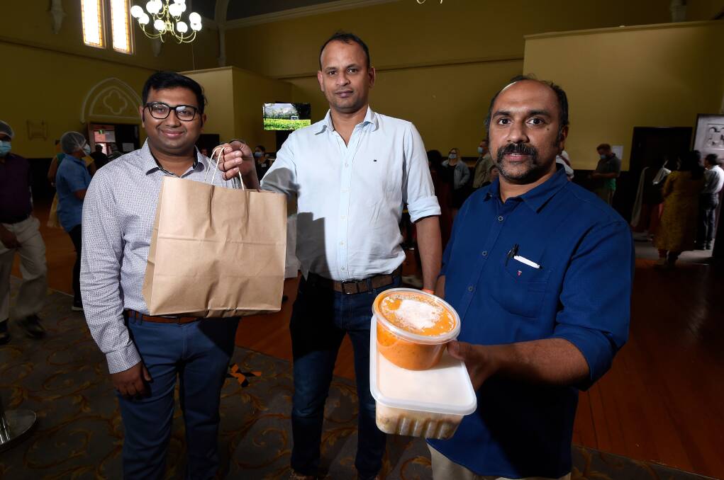 SHARING FOOD: Lokan Ravi, Juby Zacharias and Sijo Mathew played a big role in running the Indian Food Fest as part of Harmony Festival last year. Picture: Adam Trafford 