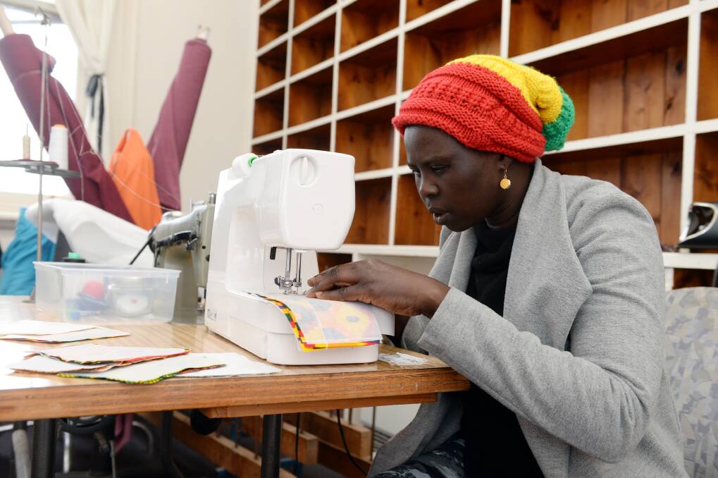 OPPORTUNITY: Owner of sewing business A Tuk Nyibol Deng works at the women's incubator space for the first time on Thursday.