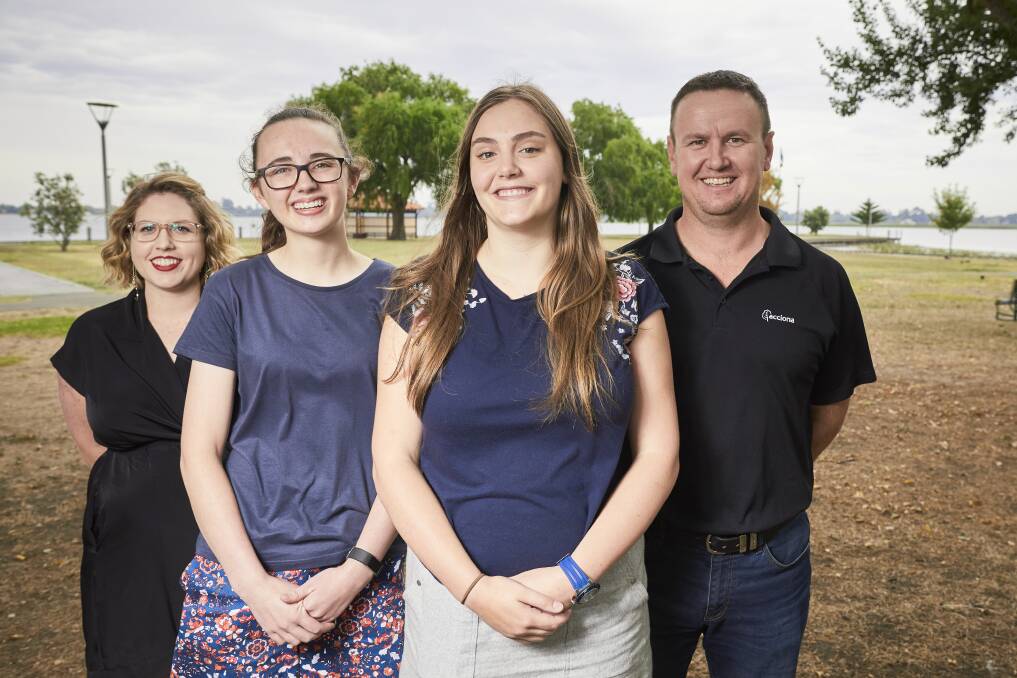 ENVIRONMENT: ACCIONA community relations officer Kirsten Lee and Waubra Wind Farm site manager Cameron Stowe are excited to hear Hannah DeBuhr and Kaitlyn Hancock's ideas for sustainability. Picture: Luka Kauzlaric