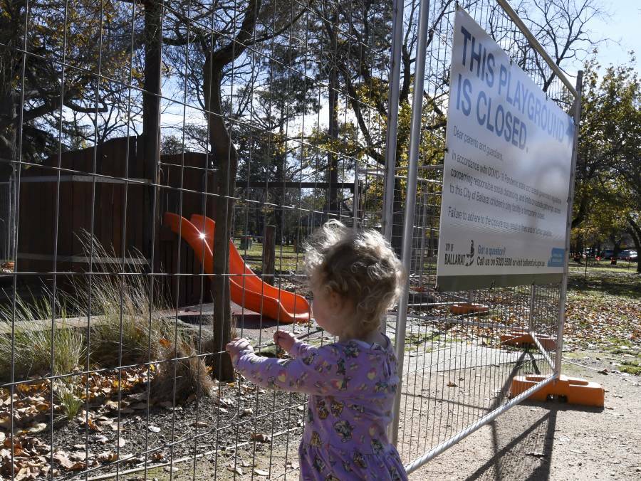 LOCKED OUT: 18-month-old Mila looks at the Indigenous play space at Lake Wendouree through a fence on Tuesday, before the re-opening of playgrounds was announced. Picture: Lachlan Bence
