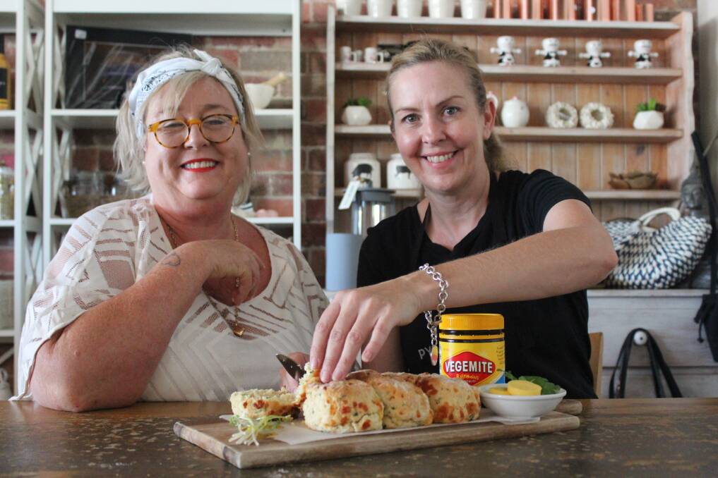 TASTE: Beaufort cafes are serving Vegemite specials. Beaufort Progress Association president Liza Robinson and Pyrenees Pantry owner Samantha Thayer try a vegemite, cheese and parsley scone. Picture: Rochelle Kirkham