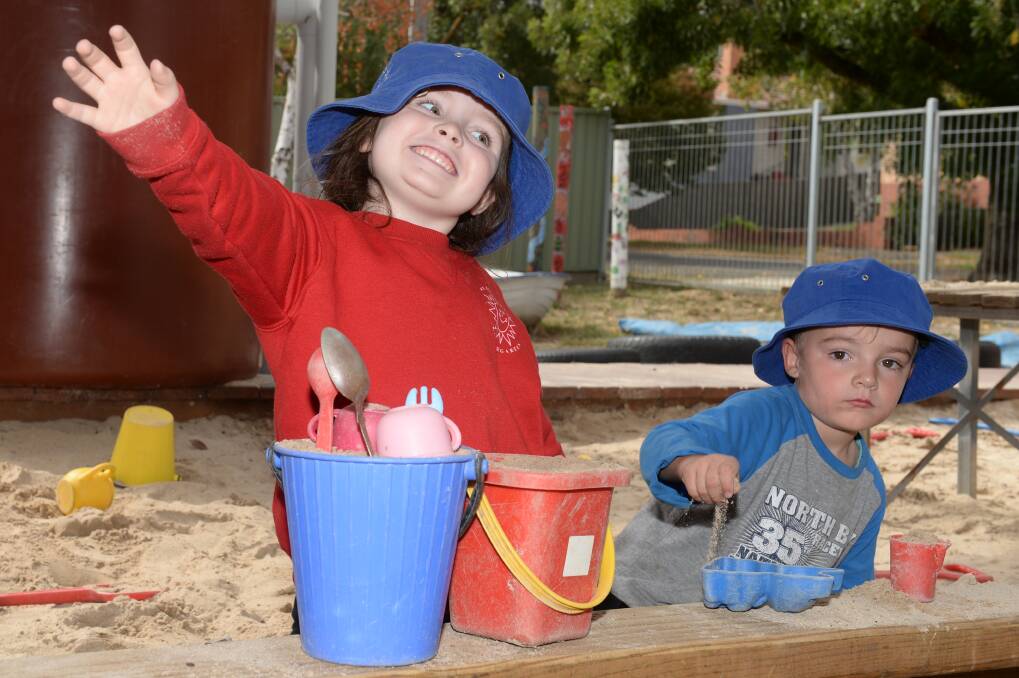 BENEFITS OF KINDER: Mount Pleasant kindergarten four-year-old program participants Imogen and Cole enjoy time learning with their hands outdoors. Picture: Kate Healy 