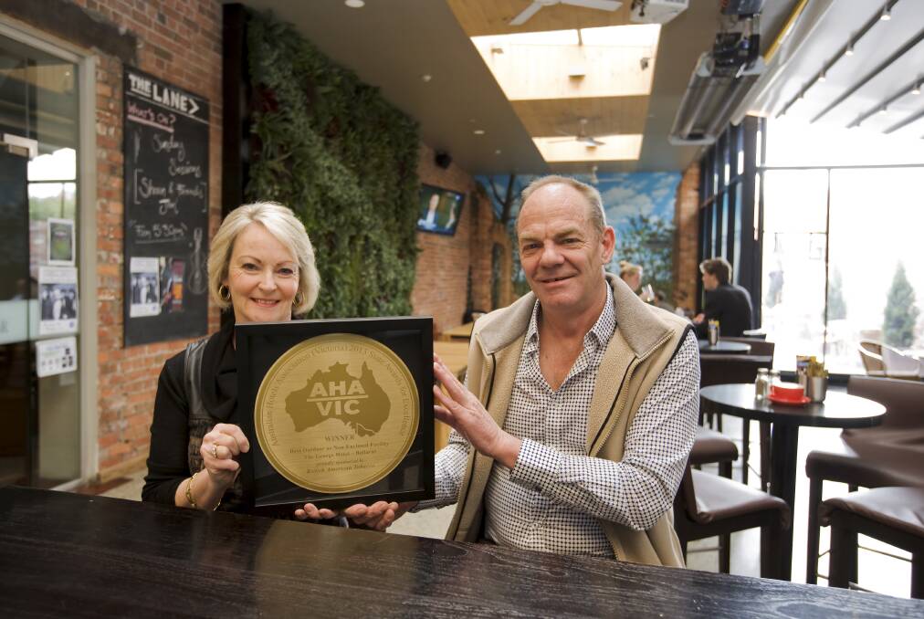 Jan and Gary Browning celebrate their award at The George Hotel in 2013. Picture: Craig Holloway 
