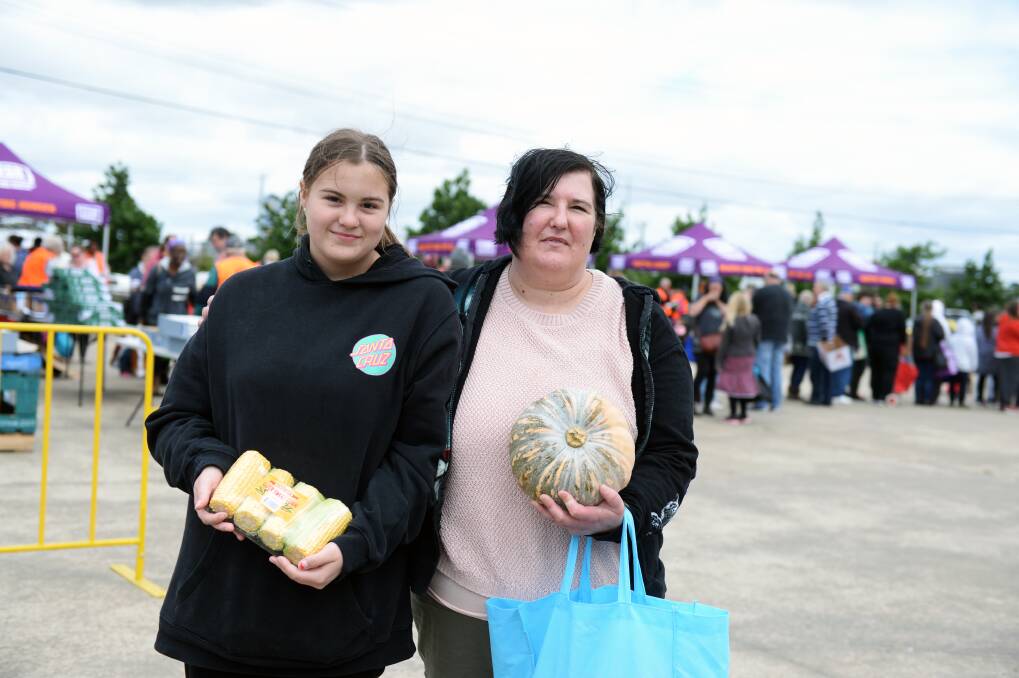 FED: Mariah Hawkins and Mandy-Louise Weber were grateful to receive fresh produce at the Foodbank pop-up farmers market in Ballarat on Thursday. Pictures: Kate Healy 
