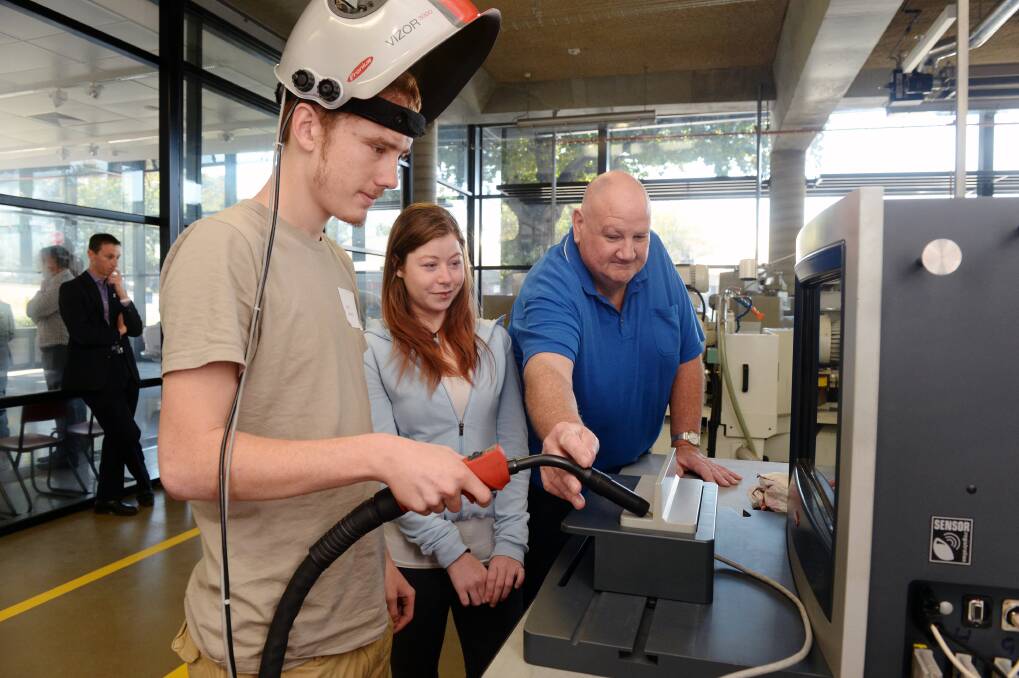 FILLING SKILLS GAP: Prep4Work program participants Liam Cassim, Eva Kropp and David Long will learn engineering skills in a 15 week program. Picture: Kate Healy 