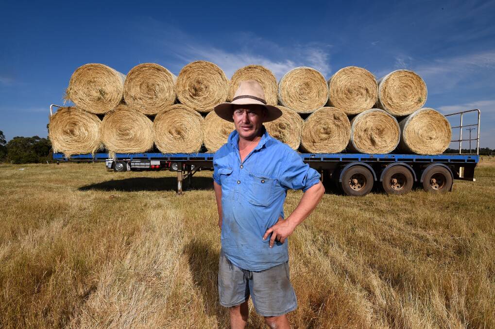 SUPPORT: Dunnstown farmer Karl Britt has collected hay from farmers in the area to take to Gippsland as part of the fire relief effort. Pictures: Adam Trafford 