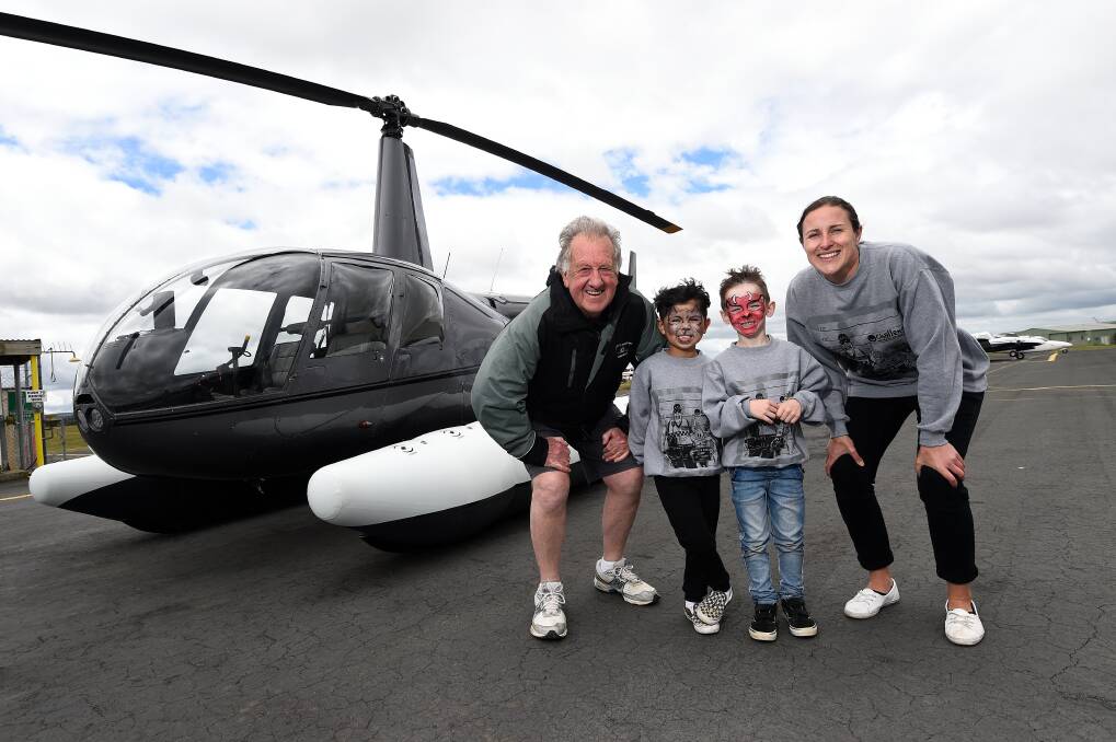 FUN: Co-founder Cops N Kids John Moloney, Jacob and Zac and Challenge Camp Co-ordinator Sarah Legg at the Ballarat Airport. Picture: Adam Trafford 
