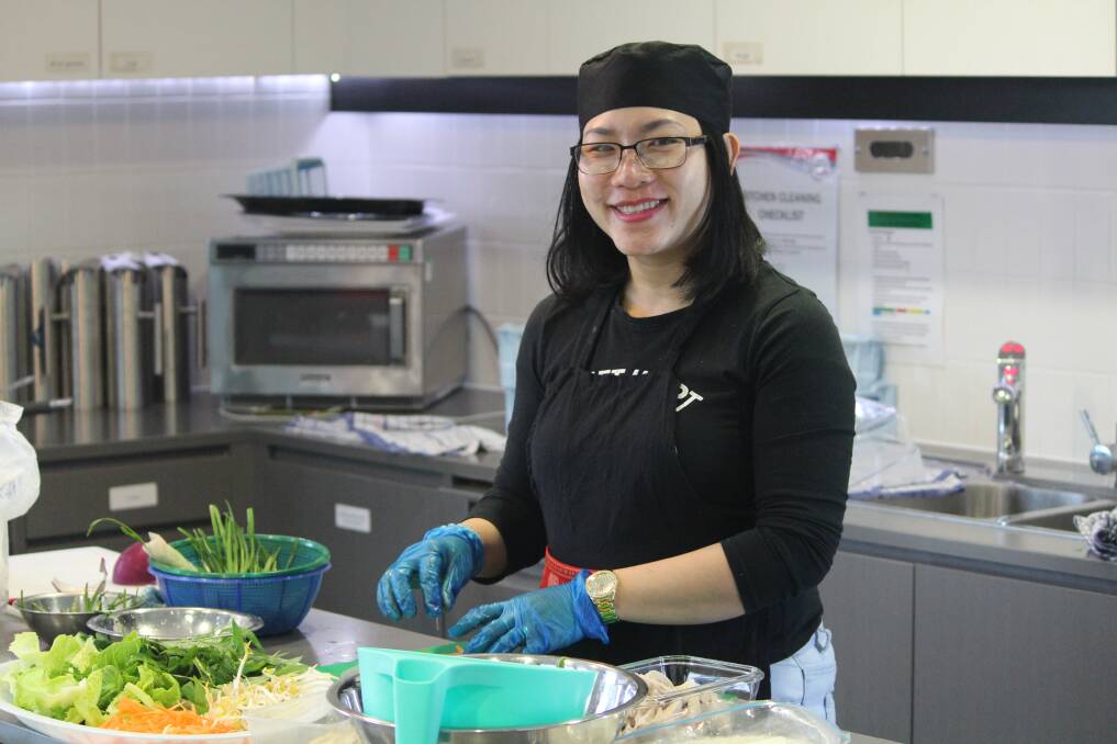 SHARING CULTURE: A Pot Of Courage chef Dung Nguyen makes her famous rice paper rolls for the social enterprise's new cafe. Pictures: Rochelle Kirkham 
