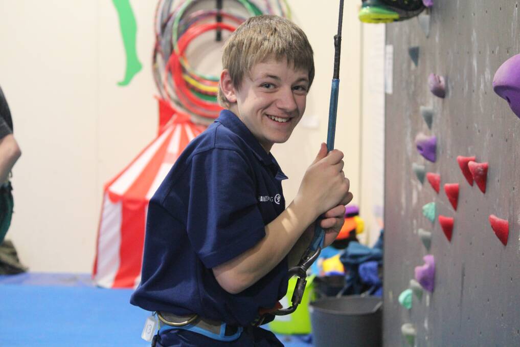 CHALLENGE: Tom Bilston, year eight Beaufort Secondary College Hands on Learning student, tries the rock climbing wall as part of the inter-school activity day. Pictures: Rochelle Kirkham 