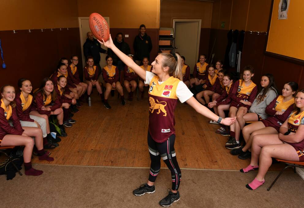 SUPPORT: Dancing With Our Stars competitor and VFLW player Amy McDonald meets with junior footballers from her old club. Picture: Lachlan Bence 