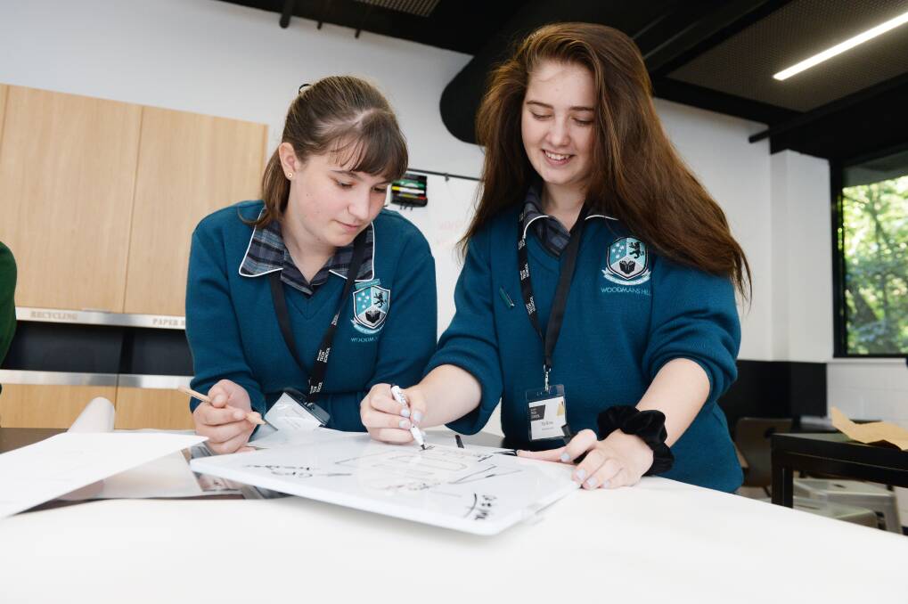 CREATIVE: Amelia Strait and Tilly Burke work on their product idea at the Ballarat Tech School on Thursday as part of the Girls in STEM program. Picture: Kate Healy 
