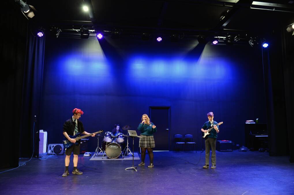 ON STAGE: Dylan Stait, Year 8, Jennifer Babic, Year 8, Sophie Lyons, Year 11, and Josh Morisa, Year 8 perform on the stage of the new performing arts centre. Pictures: Kate Healy 
