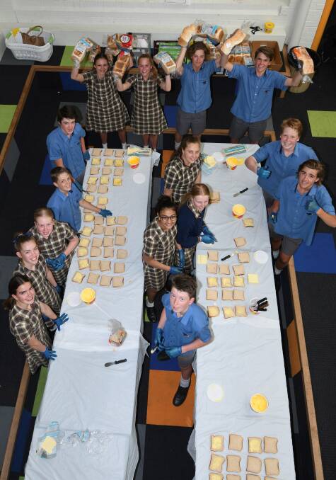 EAT UP: Ballarat Grammar students make sandwiches to deliver to primary schools. Picture: Lachlan Bence 