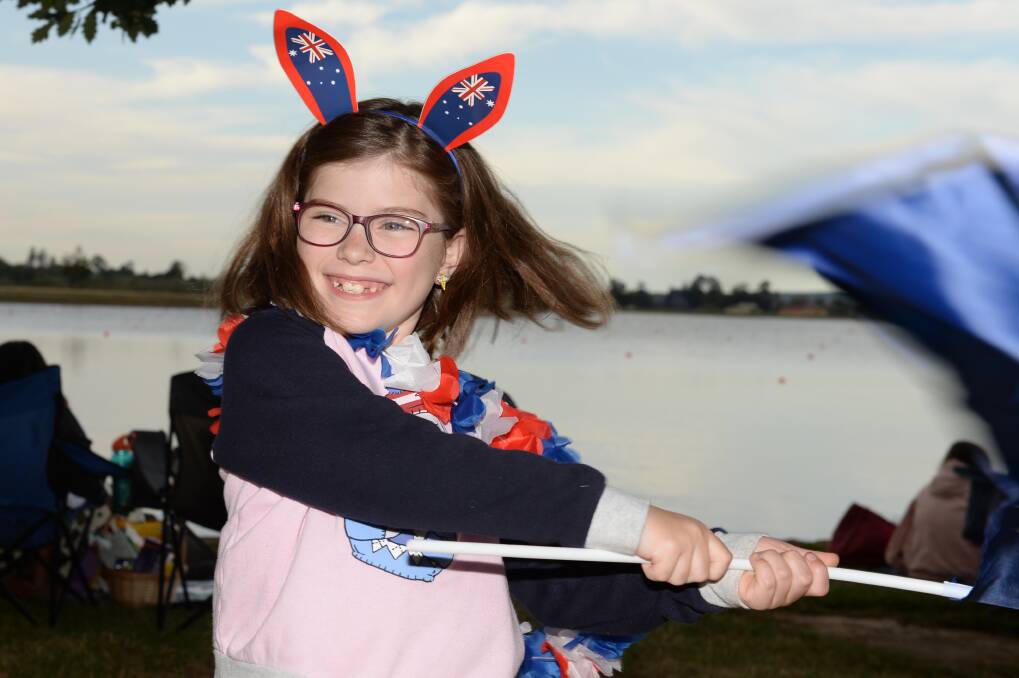 PRIDE: Lily McMaster, 7, carries the Australian flag at Lake Wendouree before the fireworks. Picture: Kate Healy 
