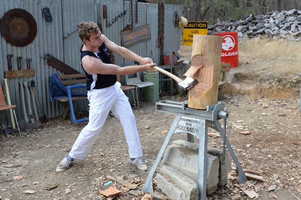 AXEMAN: Nick Jenkins, 17, is a member of the under 21s Victorian woodchopping team. Pictures: Kate Healy 
