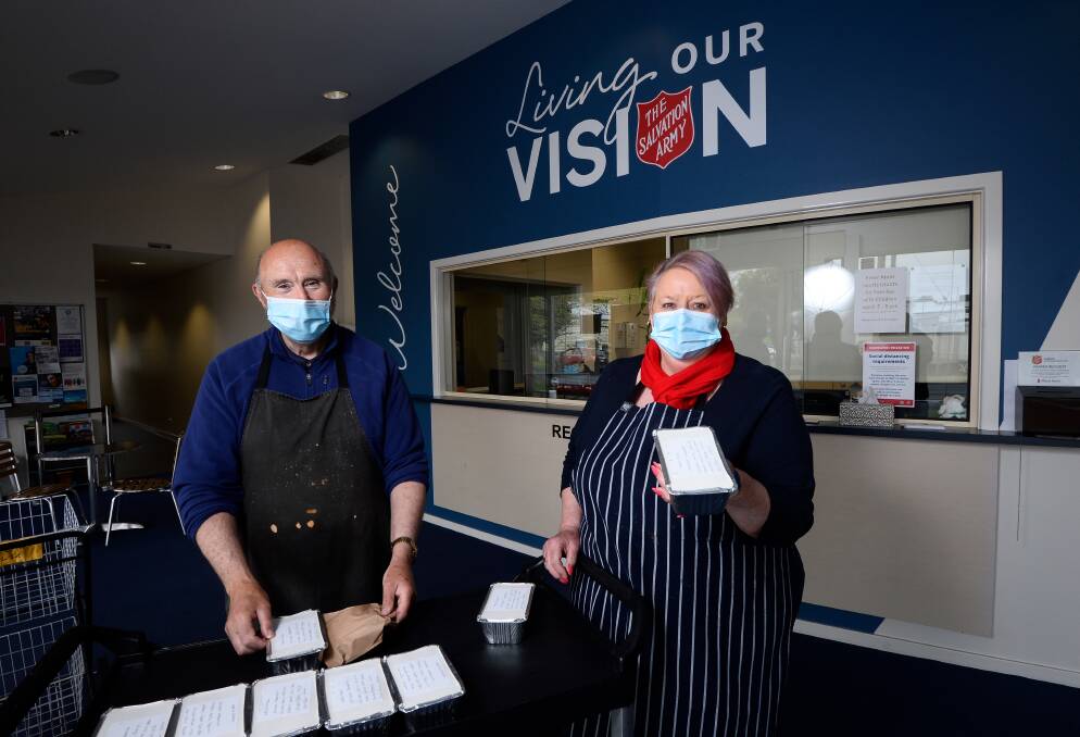 A HELPING HAND: Salvation Army Ballarat volunteer Michael Murphy and volunteer chef Lynne Veca have been providing takeaway meals to people throughout the pandemic. Pictures: Adam Trafford 