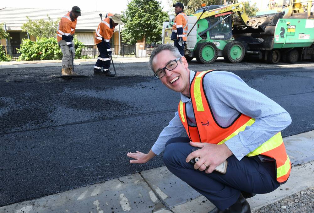 INNOVATION: City of Ballarat mayor tests the new road material containing Reconophalt recycled products. Pictures: Lachlan Bence 