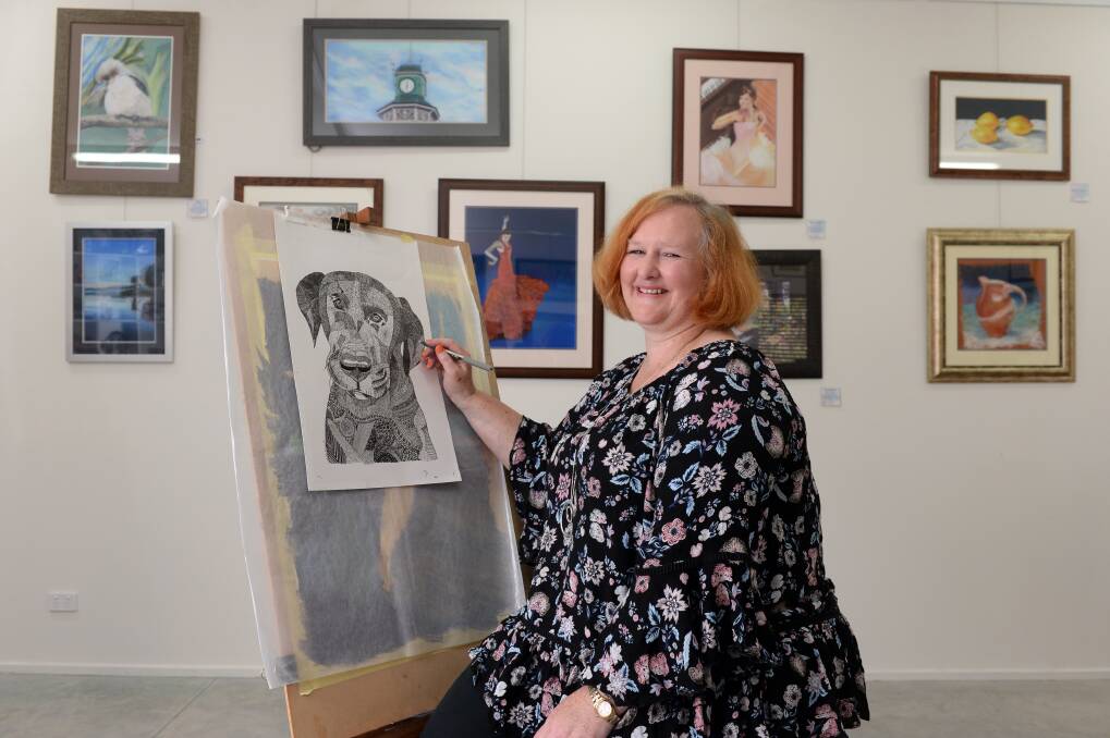 CREATIVE DISPLAY: Pastel artist Angela Gerrard prepares for her first public exhibition at her gallery at her Beaufort home. Picture: Kate Healy 
