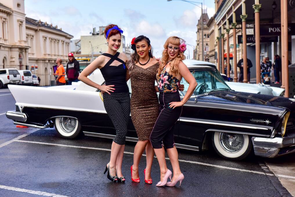 STRIKE A POSE: Amy Dunstan, Anjel Taylor and Kim Turner took the opportunity to dress up in 50s style for the festival. 